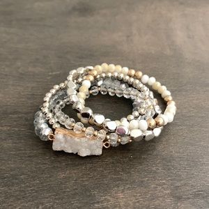 Expandable set of 5 bracelets including a beautiful gem. Never before worn.